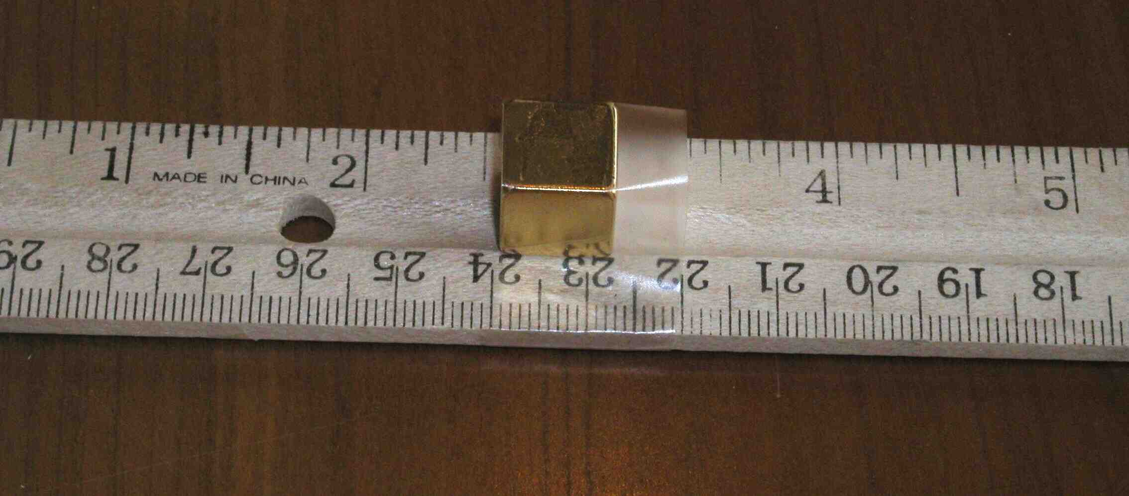 Taping the first magnet to the ruler