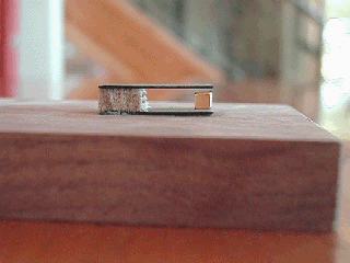 Levitating magnet spinning between two sheets of pyrolytic graphite