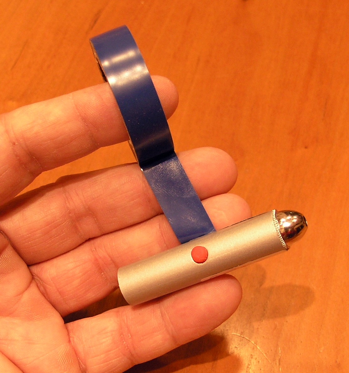 Taping the button down